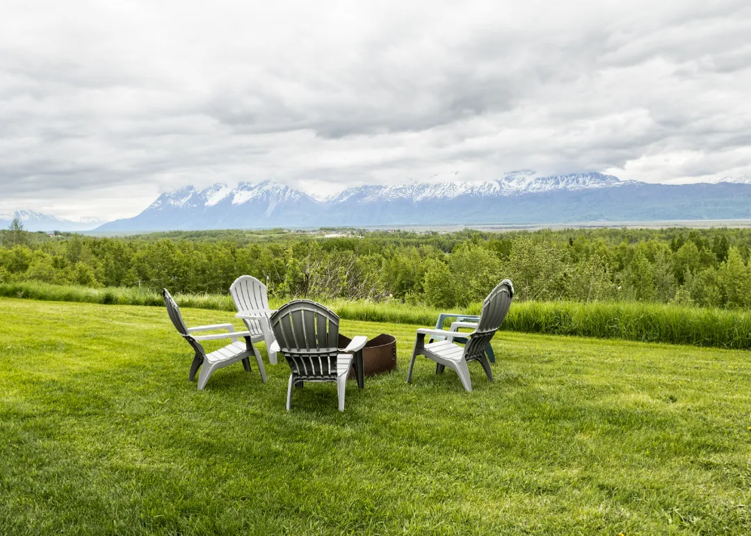 color photo sitting area outside mountain in background