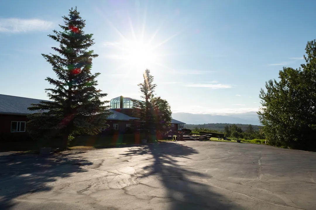 wooden cabin swing set mountains